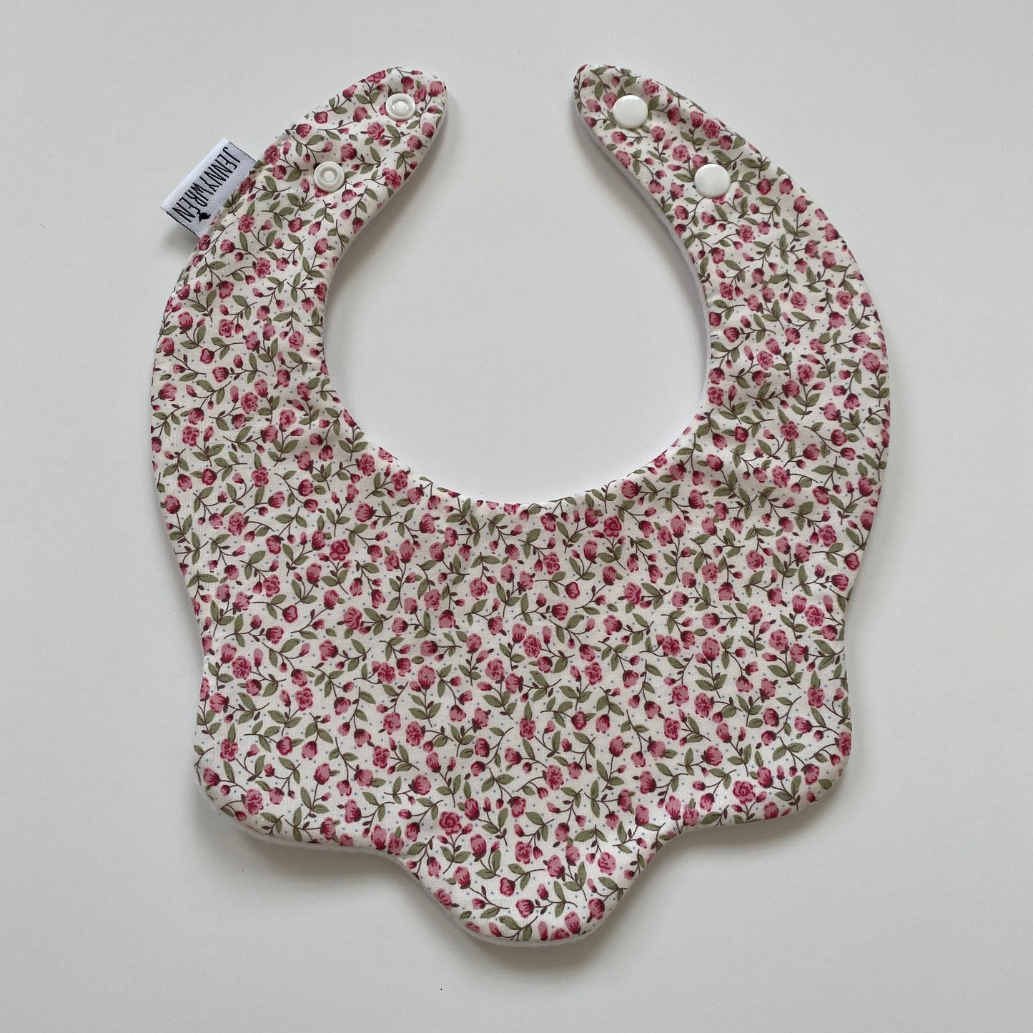 Pink floral scallop bib